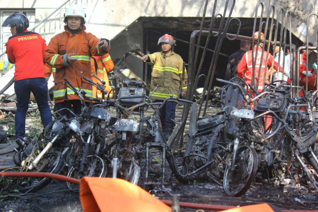 13 dead, 41 hurt as 'suicide family' bombs Indonesian churches