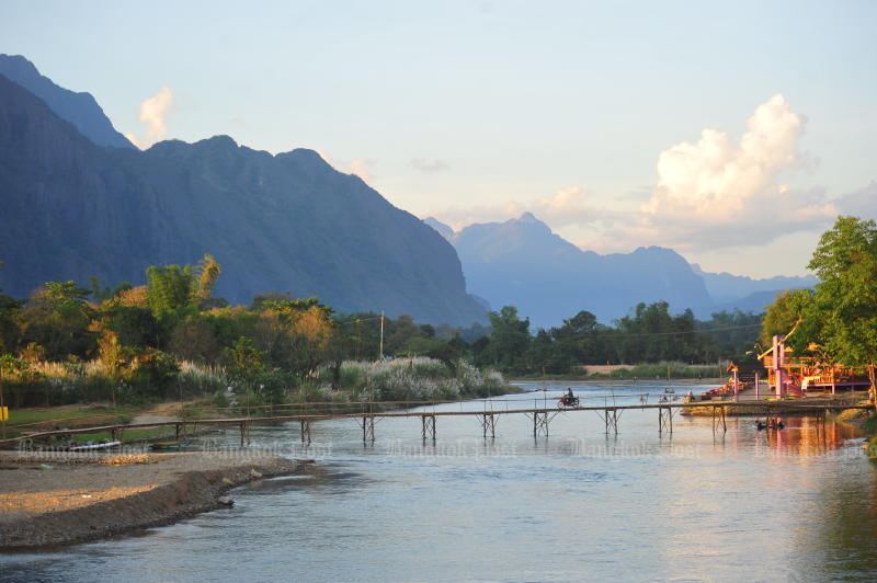 The picturesque scenery of towering karst mountains in Vang Vieng in Laos. (Photo by 
Peerawat Jariyasombat)