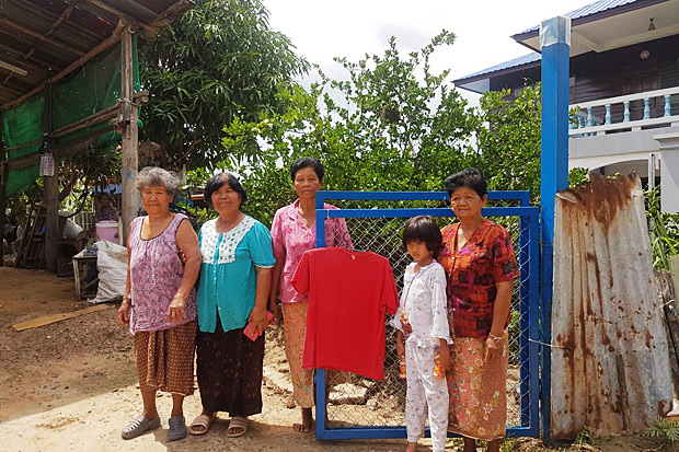 A red shirt is hung in front of a family's house to prevent what they call 'widow ghost' from visiting. Photo by Prasit Tangprasert