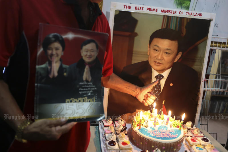 Red-shirt United Front for Democracy against Dictatorship supporters hold a birthday party for ousted prime minister Thaksin Shinawtra at Imperial World shopping mall in Lat Phrao on July 26, 2016. (Photo by Patipat Janthong)