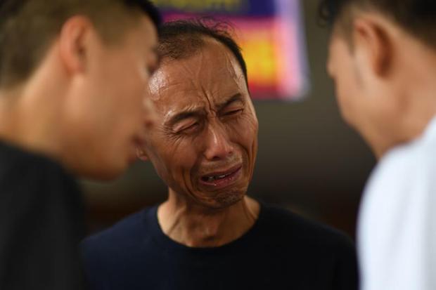A Chinese relative cries at the Vachira Phuket Hospital in Phuket on Sunday after a tourist boat carrying 105 passengers, mostly Chinese tourists, capsized in rough seas on July 5. (AFP) A Chinese relative cries at the Vachira Phuket Hospital in Phuket on Sunday after a tourist boat carrying 105 passengers, mostly Chinese tourists, capsized in rough seas on July 5. (AFP)
