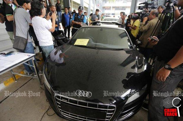 A black Audi coupe is confiscated from a gang which allegedly forged its vehicle registration details. The gang is also suspected of involvement in car theft. (Photo by Wassayos Ngamkham)