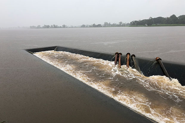 Water levels at 18 medium-size reservoirs in Kalasin keep rising due to persistent heavy rain. Four of the reservoirs are already at a maximum capacity. (Photo by Yongyut Phupuangphet)