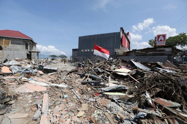 Despair grows in Indonesia quake city over planned new homes