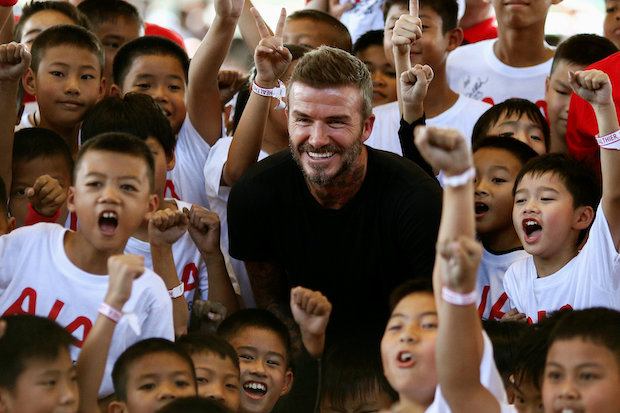 Beckham charms young footballers