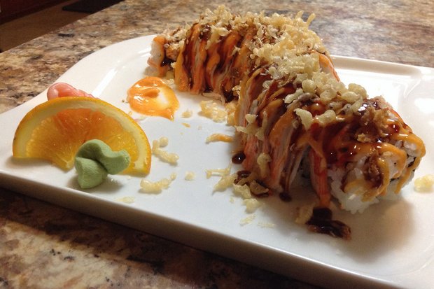 This 'Thai barbecue chicken' (gai yang) served with fruit and wasabi is one of the delights at a Thai-owned fusion restaurant, Rice Asian Grill and Sushi Bar, in Mobile, Alabama, in the US. (FB/riceasiangrillandsushibar)
