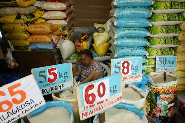 A vendor rests in her market stand that sells rice in Quezon City, Metro Manila in the Philippines on Sept 5 this year. (Reuters photo) A vendor rests in her market stand that sells rice in Quezon City, Metro Manila in the Philippines on Sept 5 this year. (Reuters photo)