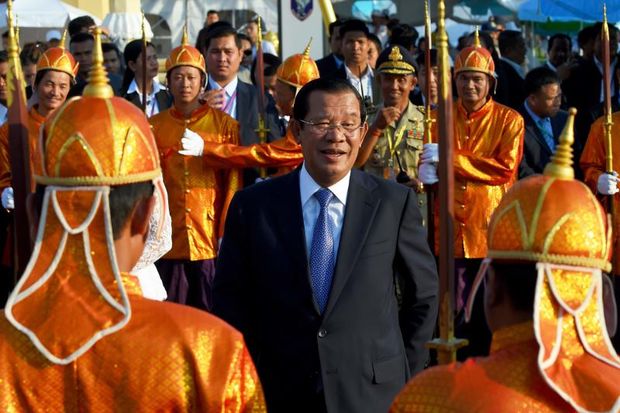 Cambodia's Prime Minister Hun Sen smiles as he arrives to attend the Water Festival in Phnom Penh on Wednesday. (AFP photo) Cambodia's Prime Minister Hun Sen smiles as he arrives to attend the Water Festival in Phnom Penh on Wednesday. (AFP photo)
