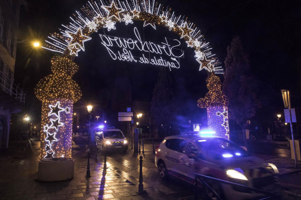 Police vehicles move at the centre of the city of Strasbourg following a shooting in eastern France on Tuesday. (AP photo)