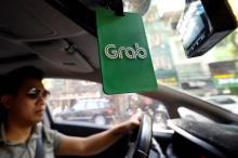 Vietnam court orders Grab to compensate money-losing rival
