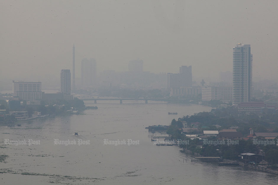 Thick haze is seen over a section of the Chao Phraya River in the Kiakkai area of Bangkok. — Pornprom Satrabhaya