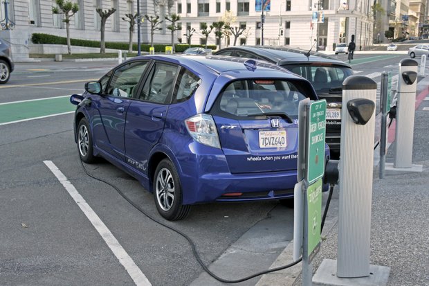 A Honda Fit EV recharges at a public station in front of San Francisco City Hall. (Creative Commons via Flickr)