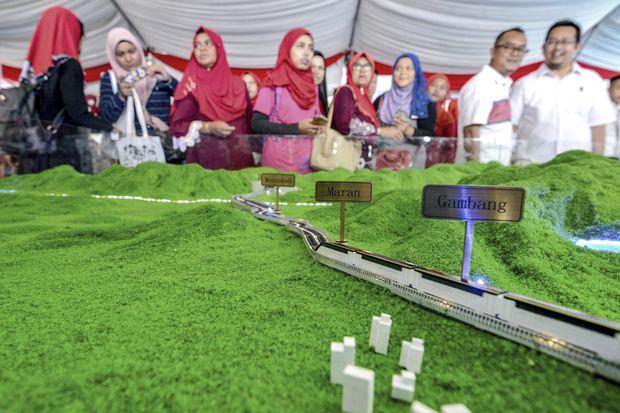 Malaysia revives China-backed rail link, cost cut by a third