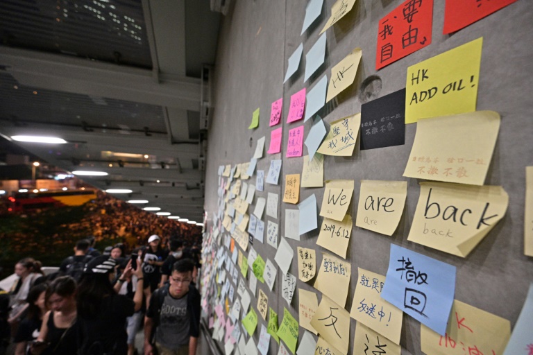 Defiance and hope in Hong Kong as police cede streets 