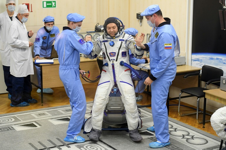 Russian, North American astronauts return to earth