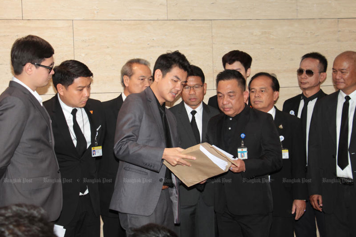 Future Forward Party secretary-general Piyabutr Saengkanokkul, centre left, files a petition on MPs' alleged media shareholding, at the parliament in Bangkok on June 4. (Photo by Tawatchai Kemgumnerd) Future Forward Party secretary-general Piyabutr Saengkanokkul, centre left, files a petition on MPs' alleged media shareholding, at the parliament in Bangkok on June 4. (Photo by Tawatchai Kemgumnerd)