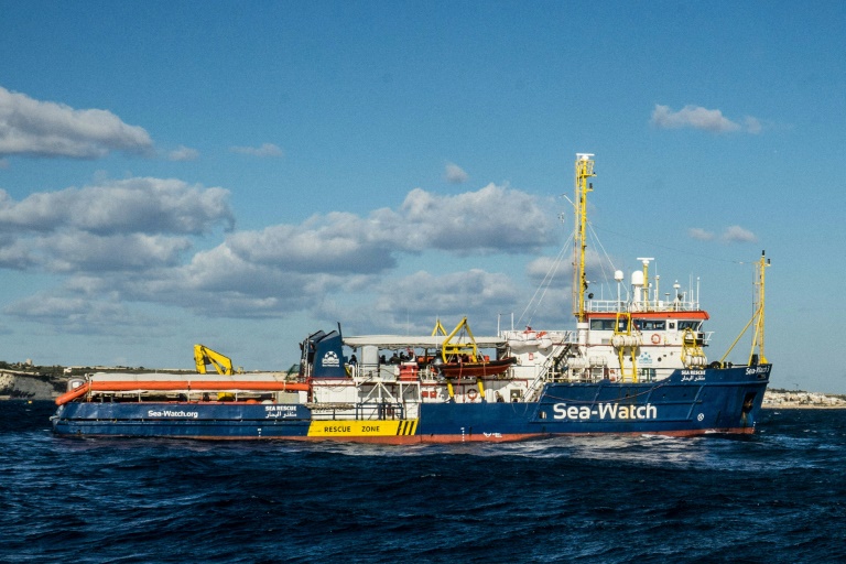 The Dutch-flagged rescue vessel Sea Watch 3 docked despite the best efforts of a coastguard boat to prevent her from doing so The Dutch-flagged rescue vessel Sea Watch 3 docked despite the best efforts of a coastguard boat to prevent her from doing so