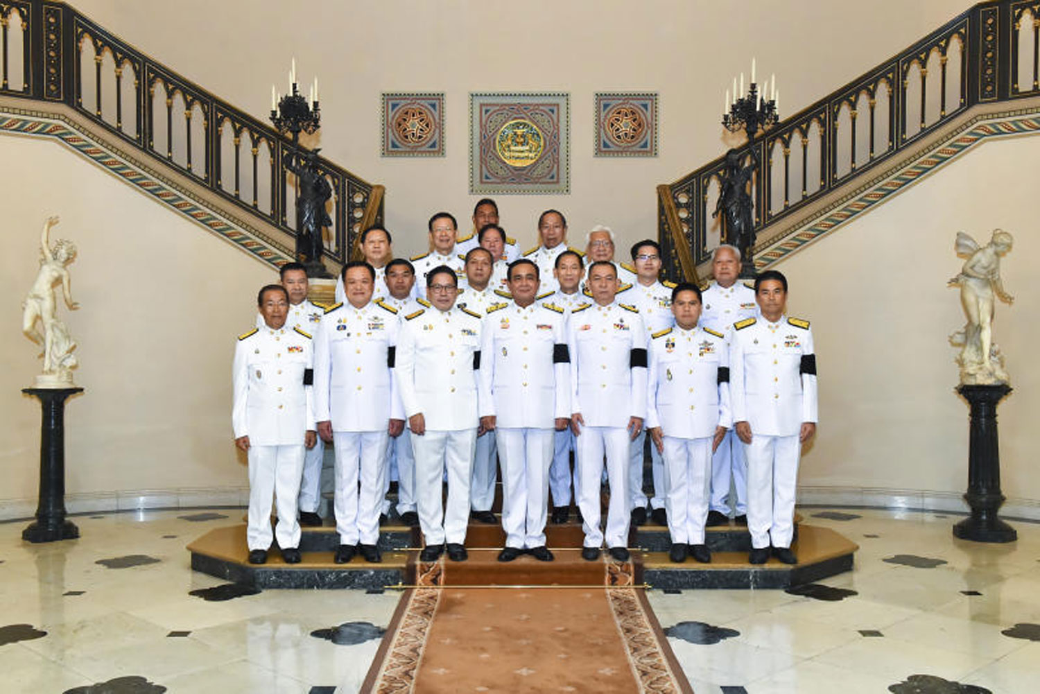 Gen Prayut Chan-o-cha, centre, poses for photos with representatives of coalition parties after receiving a royal command appointing him as the new prime minister at Government House on June 11. His new cabinet ministers were appointed on Wednesday. (Government House photo)