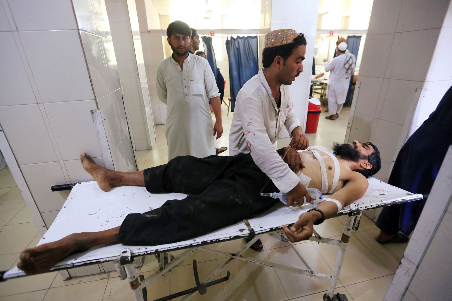 An injured man receives treatment at the hospital, after a suicide attack in Jalalabad, Afghanistan, on Friday. (Reuters photo) An injured man receives treatment at the hospital, after a suicide attack in Jalalabad, Afghanistan, on Friday. (Reuters photo)