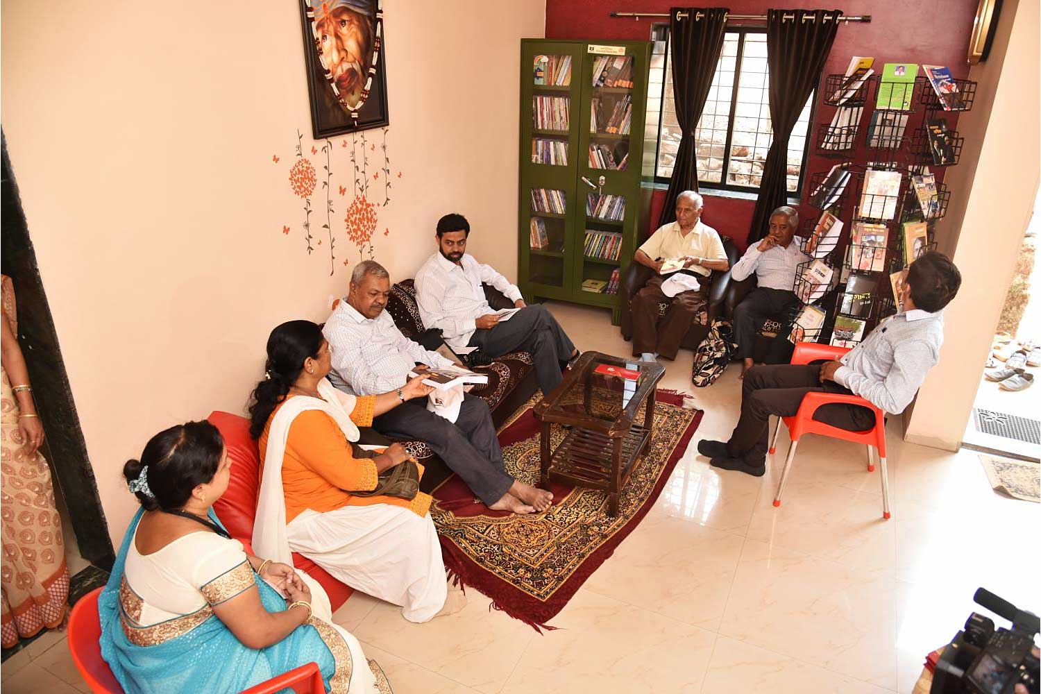 Readers gather in one of the guesthouses devoted to welcoming book lovers in Bhilar in Maharashtra state.