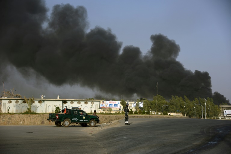 Afghan police arrive near a site of car bomb attack as smoke rises from the Police headquarters in Kandahar province on July 18, 2019. At least 11 people were killed and scores more wounded when the Taliban attacked a police headquarters in the southern city of Kandahar, officials and the insurgents say. Afghan police arrive near a site of car bomb attack as smoke rises from the Police headquarters in Kandahar province on July 18, 2019. At least 11 people were killed and scores more wounded when the Taliban attacked a police headquarters in the southern city of Kandahar, officials and the insurgents say.