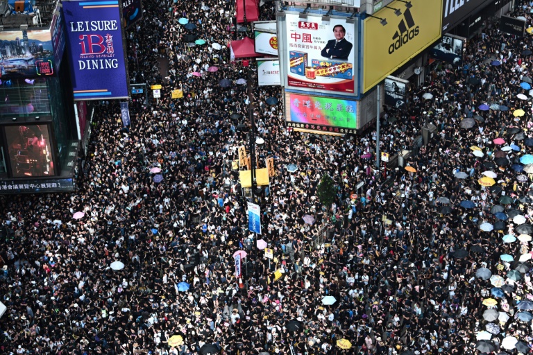 Hong Kong protesters egg China office at end of massive rally