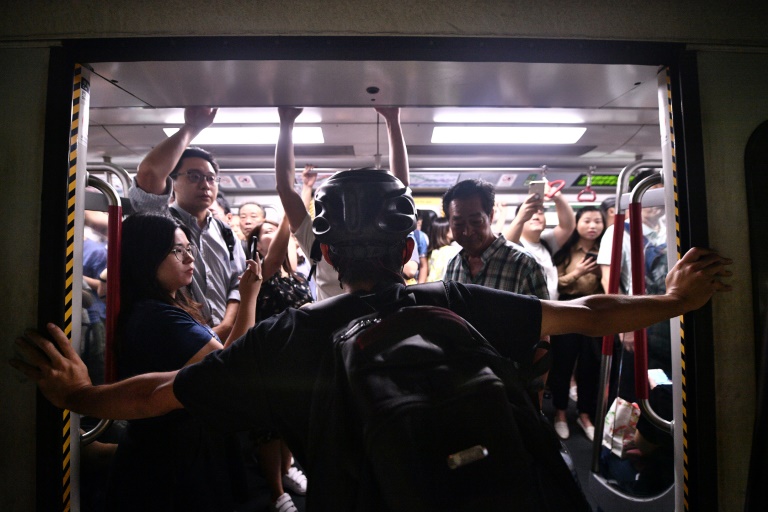 Protesters prevented the doors of subway trains closing Protesters prevented the doors of subway trains closing