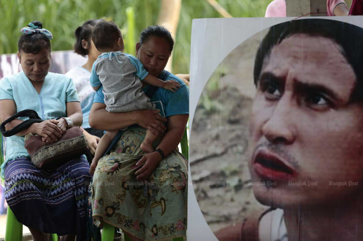 A portrait of missing Karen activist Porlajee “Billy” Rakchongcharoen is displayed at an event held in Kaeng Krachan district, Phetchaburi  province, in 2017. The Department of Special Investigation said on Tuesday he was murdered. (File photo by Patipat Janthong)