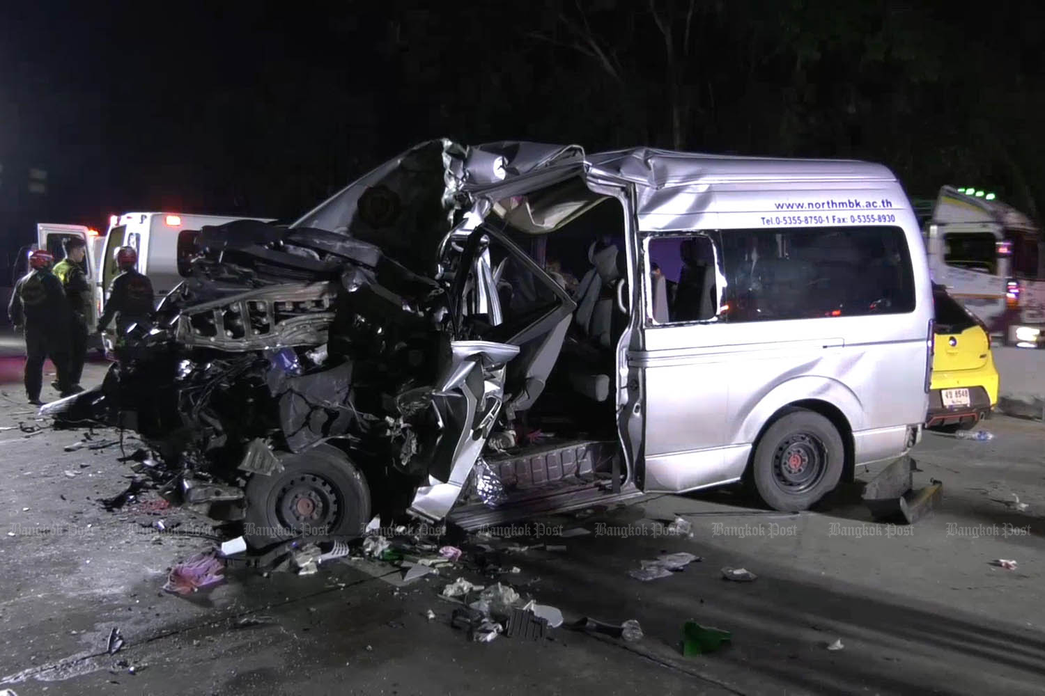 The wrecked passenger van after it ran into the rear of a lorry in Ko Kha district of Lampang on Tuesday. Three injured students on their way to receive study scholarships were killed. (Photo by Assawin Wongnorekaew)