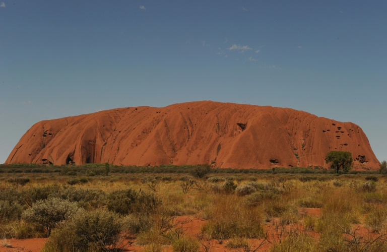 Uluru, formerly known as Ayers Rock, is a huge sandstone rock formation and the world's biggest monolith. Uluru, formerly known as Ayers Rock, is a huge sandstone rock formation and the world's biggest monolith.