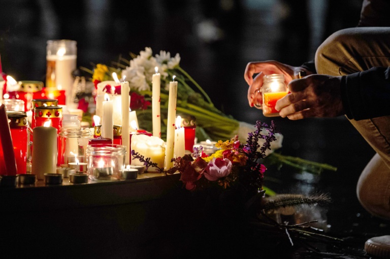 People leave candles and flowers at a vigil at the Marktplatz in Halle, eastern Germany People leave candles and flowers at a vigil at the Marktplatz in Halle, eastern Germany