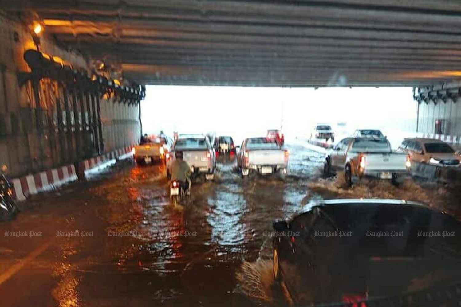 An underpass is flooded in Muang district of Chiang Mai province on Monday. (Photo by Panumet Tanraksa).