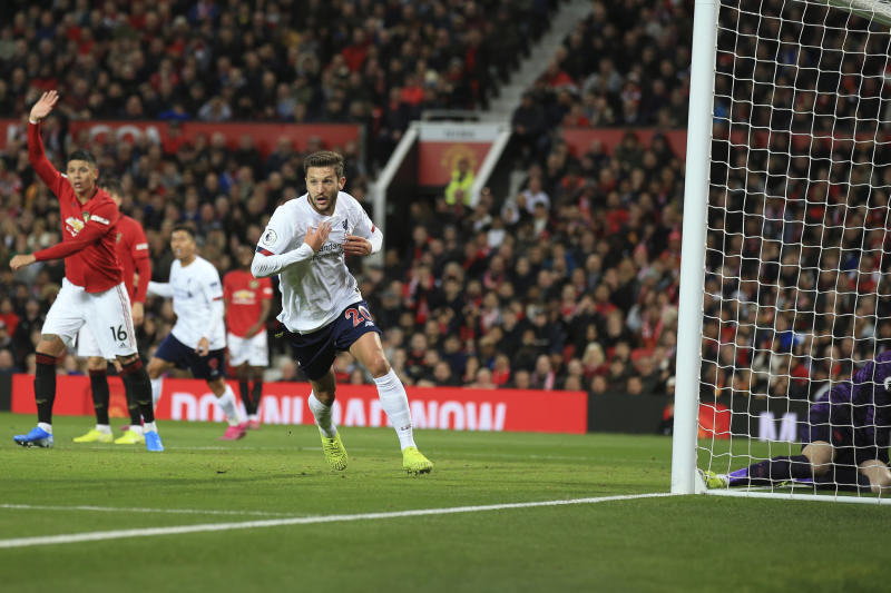 Liverpool's Adam Lallana celebrates after scoring his side's goal during the English Premier League soccer match between Manchester United and Liverpool at the Old Trafford stadium in Manchester on Sunday. (AP photo) Liverpool's Adam Lallana celebrates after scoring his side's goal during the English Premier League soccer match between Manchester United and Liverpool at the Old Trafford stadium in Manchester on Sunday. (AP photo)