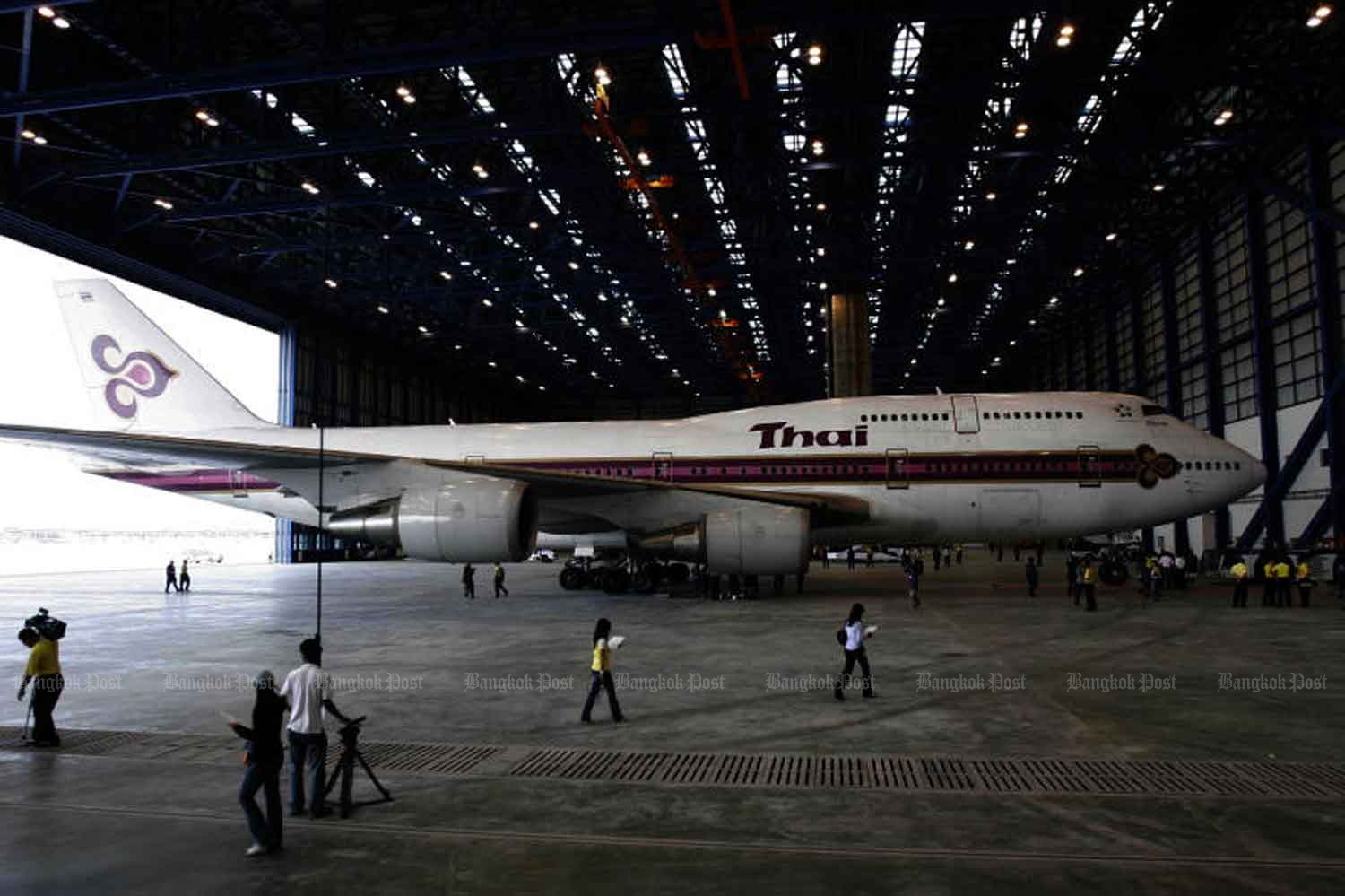 A Thai Airways International plane is seen at Suvarnabhumi airport’s maintenance centre in Samut Prakan province. The airline's president on Tuesday voiced serious concern about the loss-ridden national airline's future and cited this aircraft waiting for repairs as an example of why it was losing so much money. (Bangkok Post file photo)