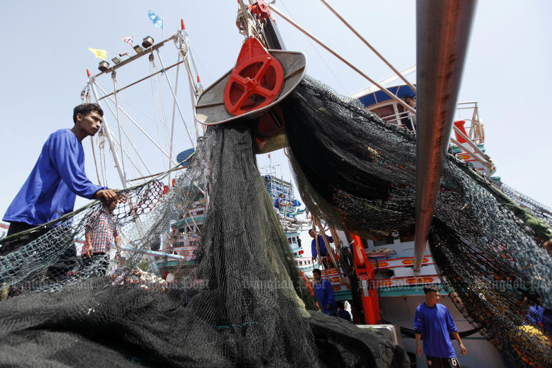 Fishermen use a machine to haul in a fishing net onto a boat in Pattani in August. (Bangkok Post photo) Fishermen use a machine to haul in a fishing net onto a boat in Pattani in August. (Bangkok Post photo)
