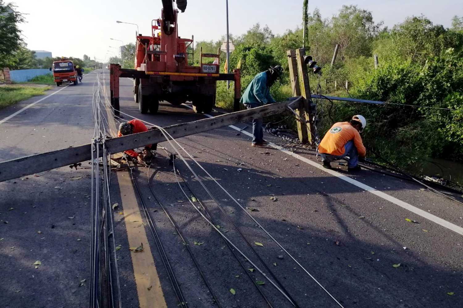 Storm brings down power poles, new weather warning