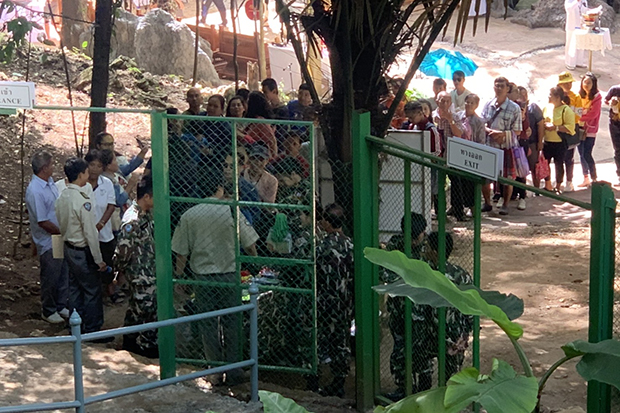 Tourists flock to Tham Luang cave on opening day