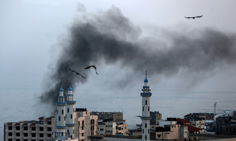 Smoke rises over Gaza City as Israel carries out a second day of air and missile strikes in response to barrages of rocket fire following its targeted killing of a top militant. Smoke rises over Gaza City as Israel carries out a second day of air and missile strikes in response to barrages of rocket fire following its targeted killing of a top militant.
