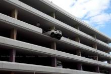 Another driver narrowly escapes car park fall