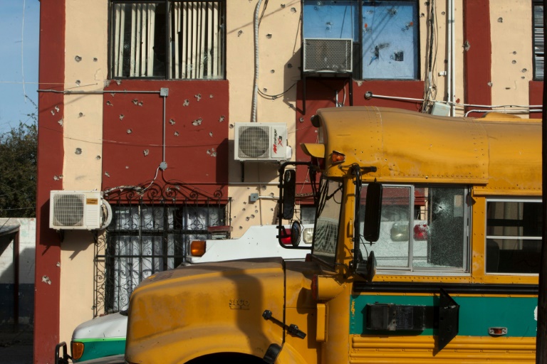 A school bus in Villa Union, in Mexico's Coahuila state, scene of a deadly weekend assault by cartel gunmen. A school bus in Villa Union, in Mexico's Coahuila state, scene of a deadly weekend assault by cartel gunmen.