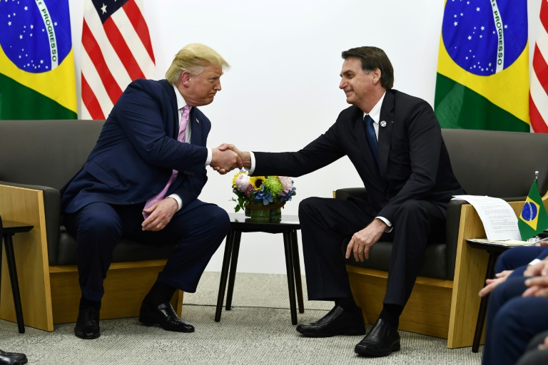 Brazil's President Jair Bolsonaro (right) says he has a direct line to US President Donald Trump -- which he may need if Washington reimposes tariffs on his country's steel and aluminum industries. Brazil's President Jair Bolsonaro (right) says he has a direct line to US President Donald Trump -- which he may need if Washington reimposes tariffs on his country's steel and aluminum industries.