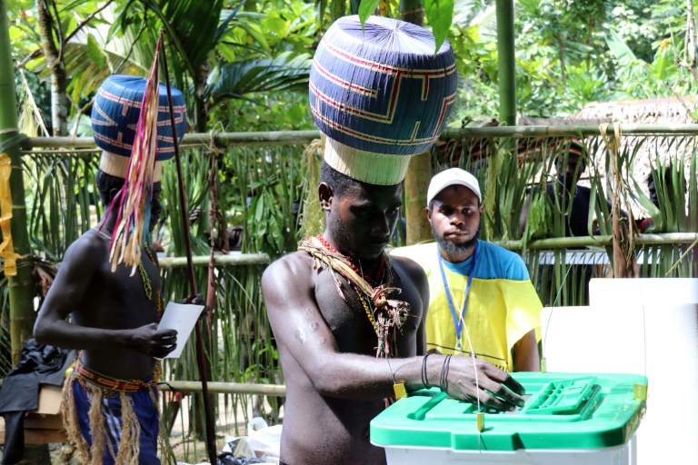 Young Upe men cast their votes in the Bougainville Referendum at the men's only polling station in Teau Bougainville, Papua New Guinea. Young Upe men cast their votes in the Bougainville Referendum at the men's only polling station in Teau Bougainville, Papua New Guinea.