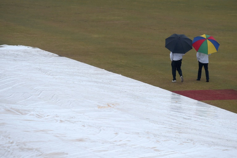 Groundsmen wiped water from the pitch covers and rolled out a super sopper, but overcast conditions and poor light forced umpires Richard Kettleborough and Michael Gough to call off play Groundsmen wiped water from the pitch covers and rolled out a super sopper, but overcast conditions and poor light forced umpires Richard Kettleborough and Michael Gough to call off play