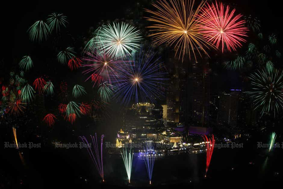 Fireworks light up the sky over the Chao Phraya River in Bangkok as the New Year countdown reaches its climax. — Wichan Charoenkiatpakul