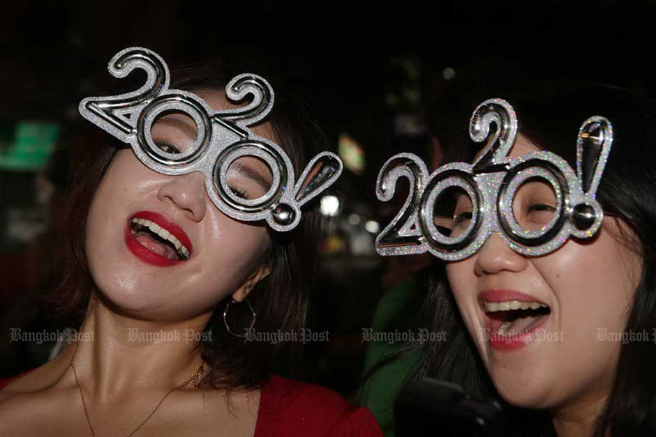 Tourists celebrate the New Year on Khao San Road in Bangkok.