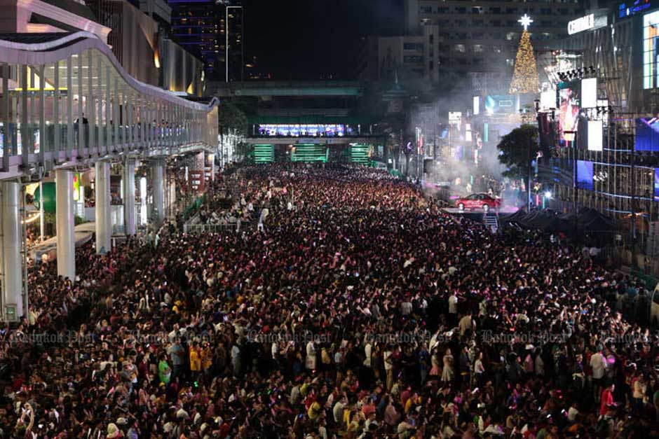 A huge crowd of people packs Ratchadamri Road in Bangkok for a New Year countdown event. — Chanat Katanyu