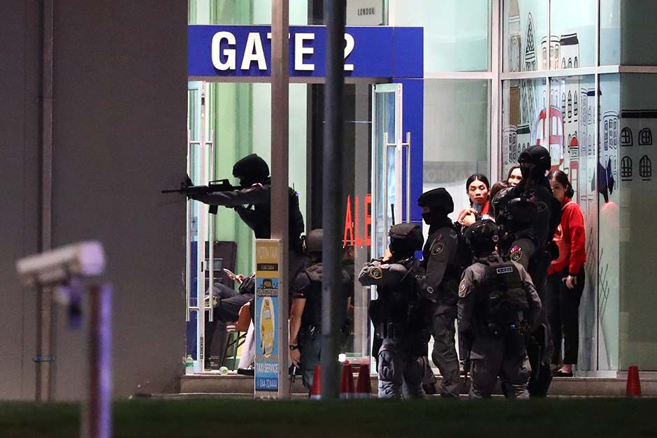 Authorities enter the mall as they chase Sgt Maj 1st Class Jakrapanth on Saturday. — Reuters