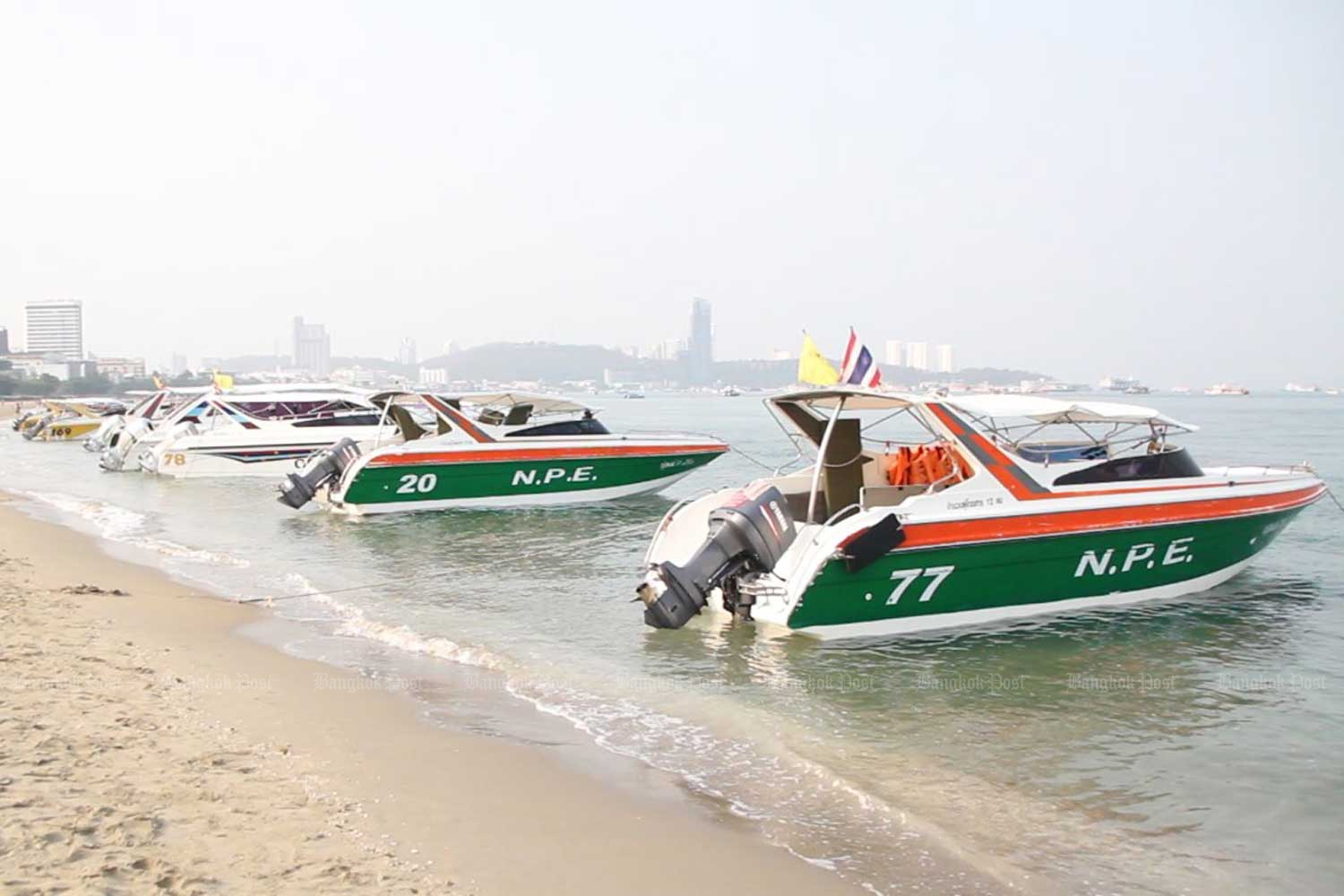 Speedboats wait for tourists on Pattaya beach, Chon Buri. (Photo by Chaiyot Pupattanapong)