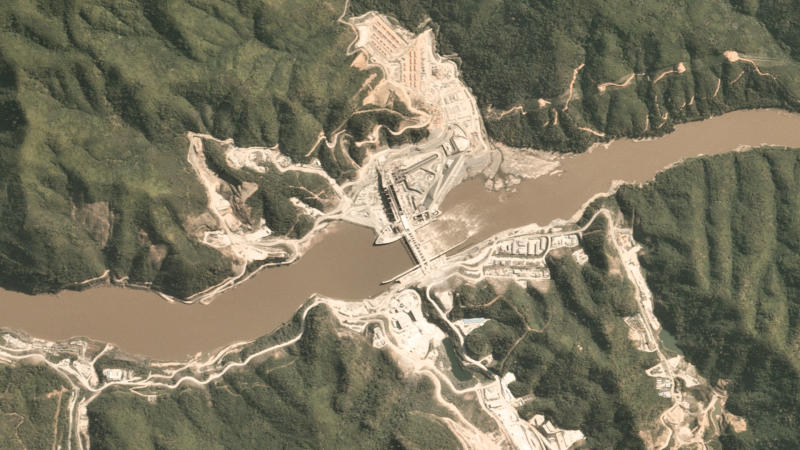 A file satellite image shows Xayaburi Dam sitting astride the normally brown waters of the Mekong River near the town of Xayaboury, Laos, Dec 24, 2017. (Planet Labs Inc./Handout via REUTERS)