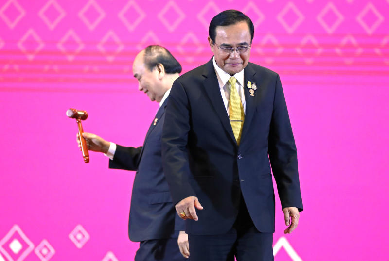 Vietnamese Prime Minister Nguyen Xuan Phuc holds the gavel after Prime Minister Prayut Chan-o-cha handed over the Asean chairmanship to Vietnam during the closing ceremony of the 35th Asean Summit and related summits in Bangkok on Nov 4, 2019. (Reuters photo)